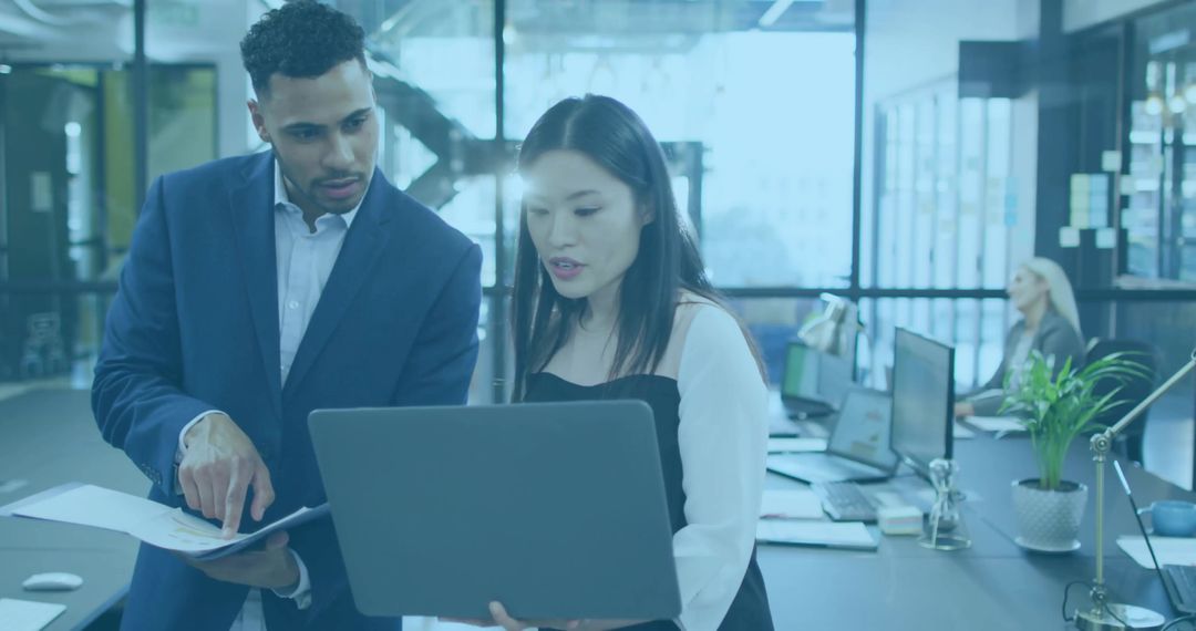Two Business Professionals Collaborating in Modern Office Setting