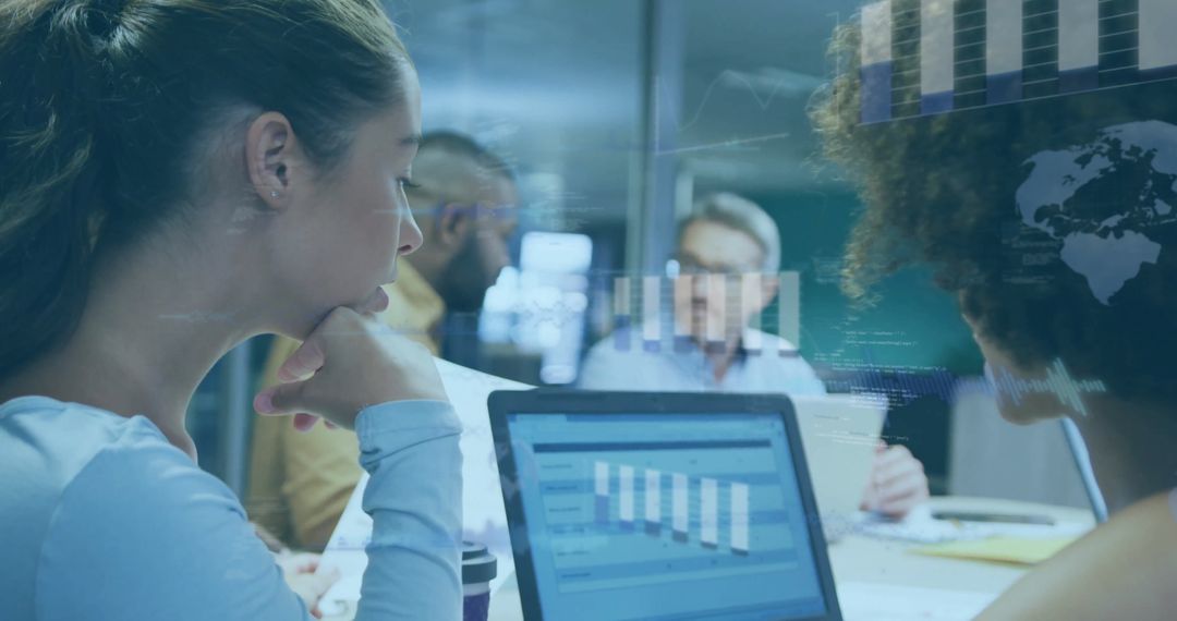 Diverse Team Collaborating on Financial Data Analysis in Office Environment