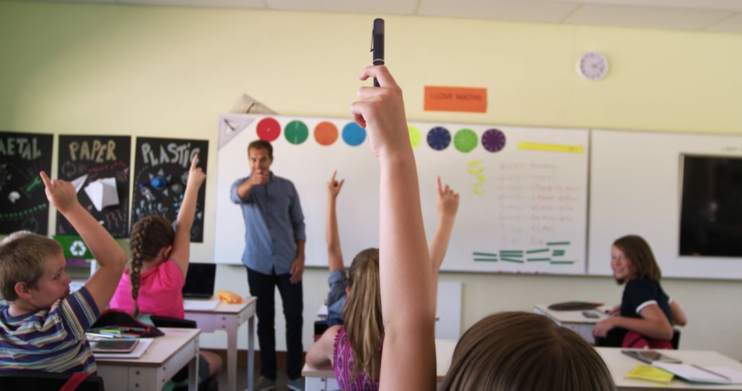 Students Raising Hands in Classroom with Teacher Leading Lesson - Free Images, Stock Photos and Pictures on Pikwizard.com