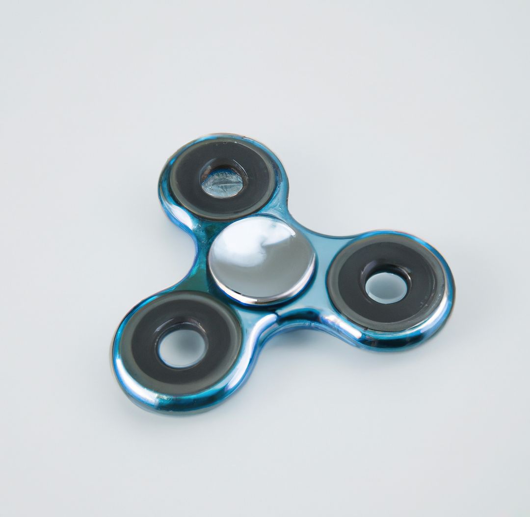 Blue Metallic Fidget Spinner with Black Bearings on White Background - Free Images, Stock Photos and Pictures on Pikwizard.com