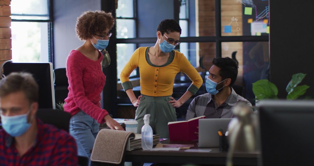 Team Collaborating with Masks in Modern Office