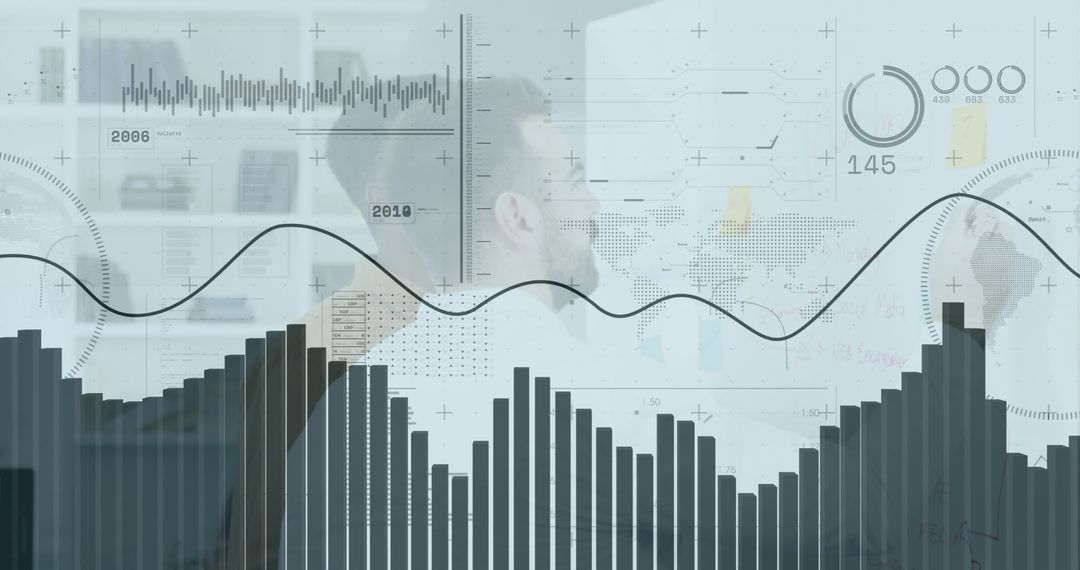 Businessman Analyzing Financial Data with Graphs and Technology Interface