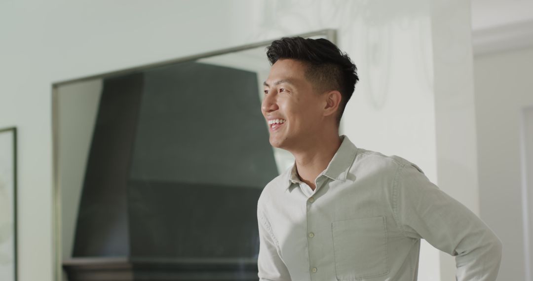Smiling Businessman in Relaxed Workspace Setting