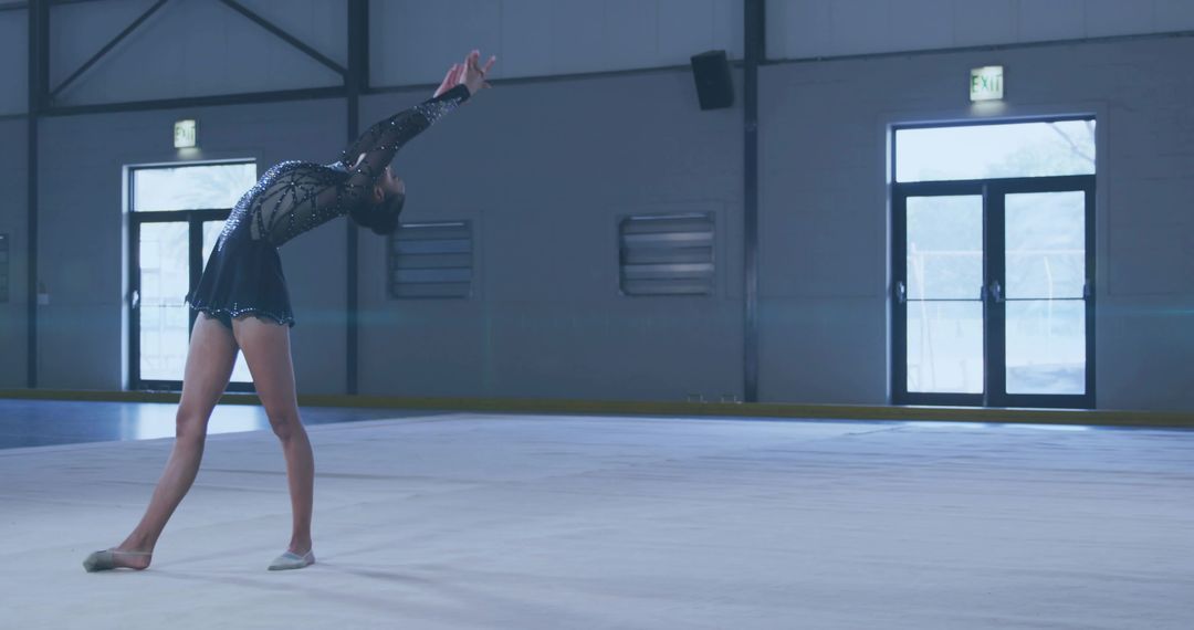 Graceful Figure Skater Demonstrating Balance and Flexibility