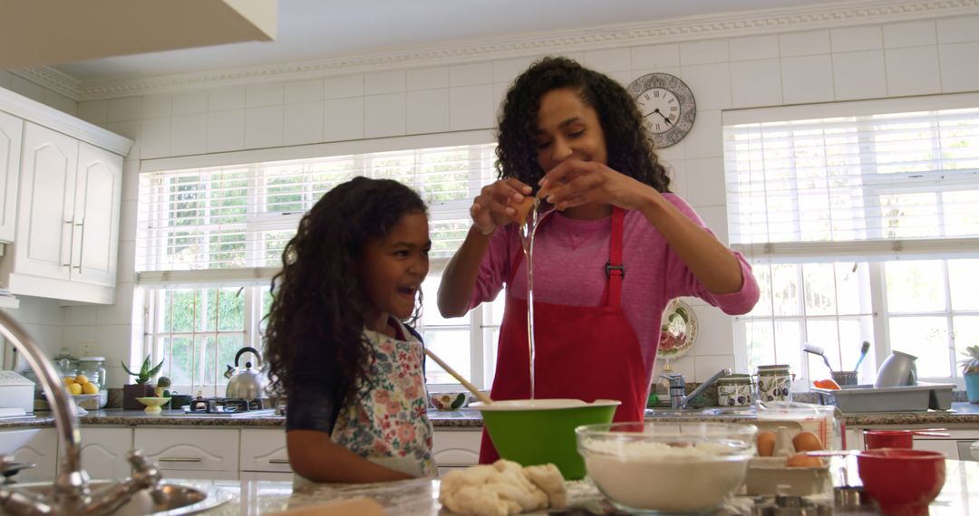 Mother and Daughter Baking Together in a Bright Kitchen - Free Images, Stock Photos and Pictures on Pikwizard.com