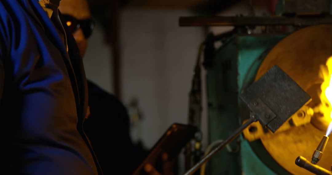 Workers Using High-Temperature Torch in Industrial Workshop - Free Images, Stock Photos and Pictures on Pikwizard.com