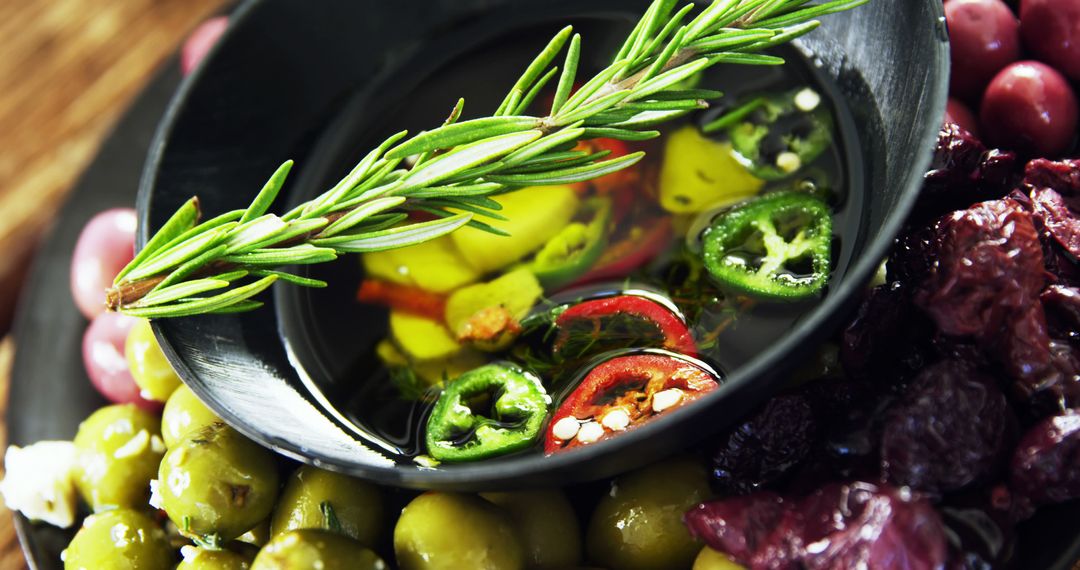 Close-up of Fresh Herb, Pickled Olives, and Chili Peppers in Olive Oil - Free Images, Stock Photos and Pictures on Pikwizard.com