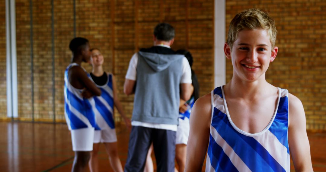 Smiling Teenage Athlete during Basketball Practice in Gym - Free Images, Stock Photos and Pictures on Pikwizard.com