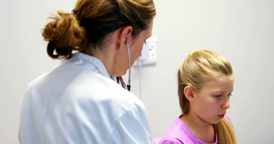 Female Doctor Examining Young Girl with Stethoscope - Free Images, Stock Photos and Pictures on Pikwizard.com