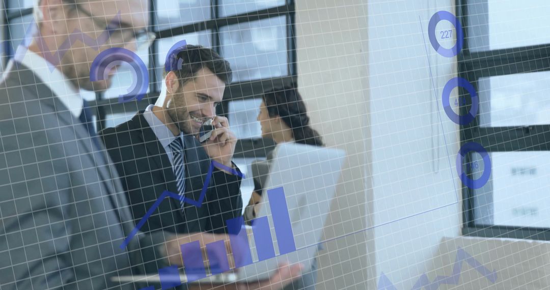 Business Professionals Analyzing Data with Overlayed Graphics