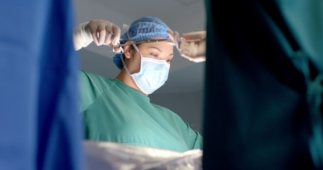 Surgical Team Collaborating during Operation with Tools