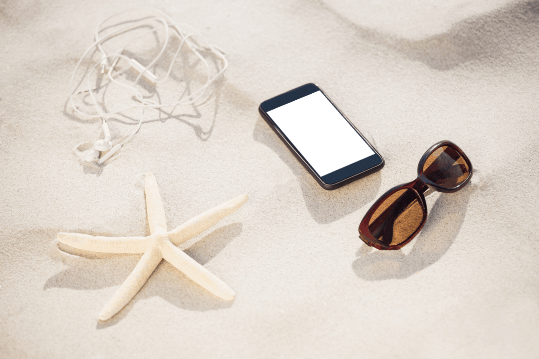Beach Vibes: Transparent Phone and Accessories on Sand
