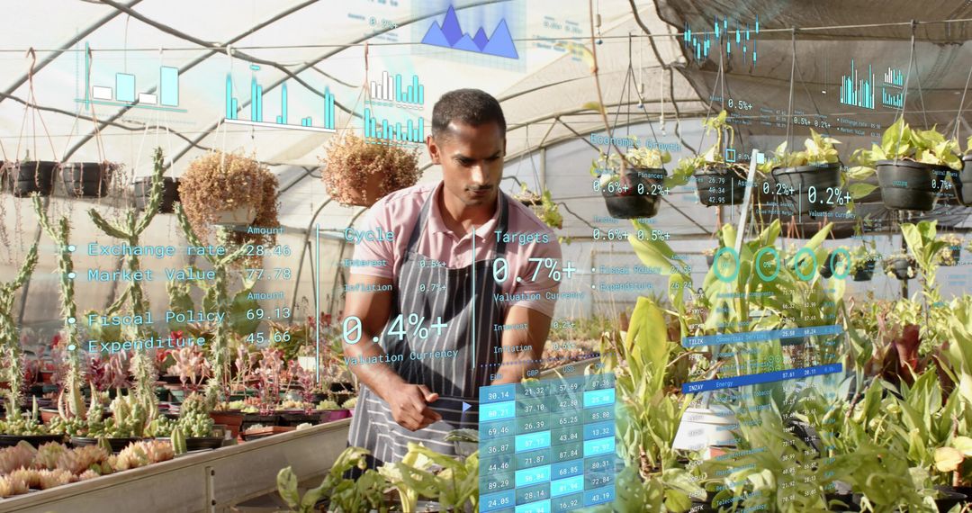 Asian horticulturist inspecting succulents in greenhouse with AR analytics and crop data