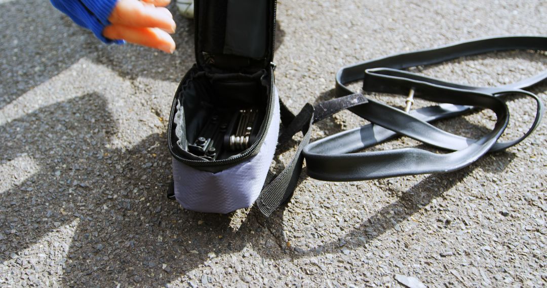 Close-up of Bicycle Tire Repair Kit on Pavement - Free Images, Stock Photos and Pictures on Pikwizard.com