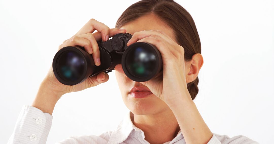 Businesswoman Holding Binoculars for Strategic Planning - Free Images, Stock Photos and Pictures on Pikwizard.com