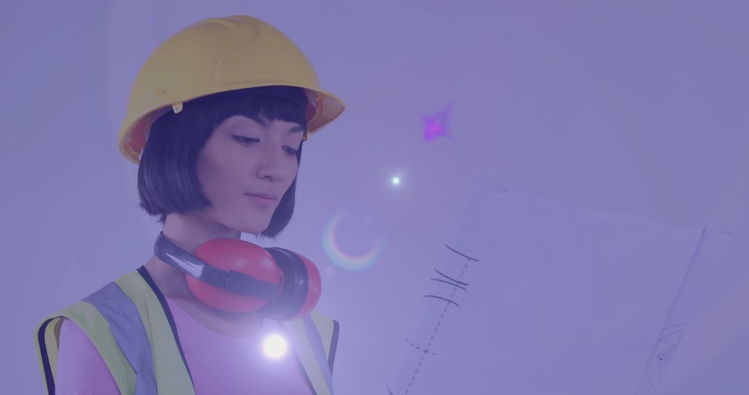 Engineer Reviewing Plans with Futuristic Light Trails