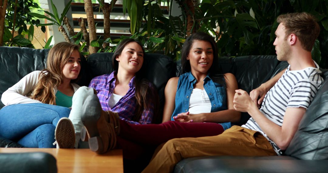 Group of friends relaxing and conversing in cozy home setting