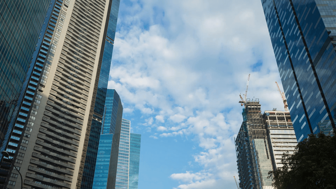 Transparent city skyscrapers with clear blue sky