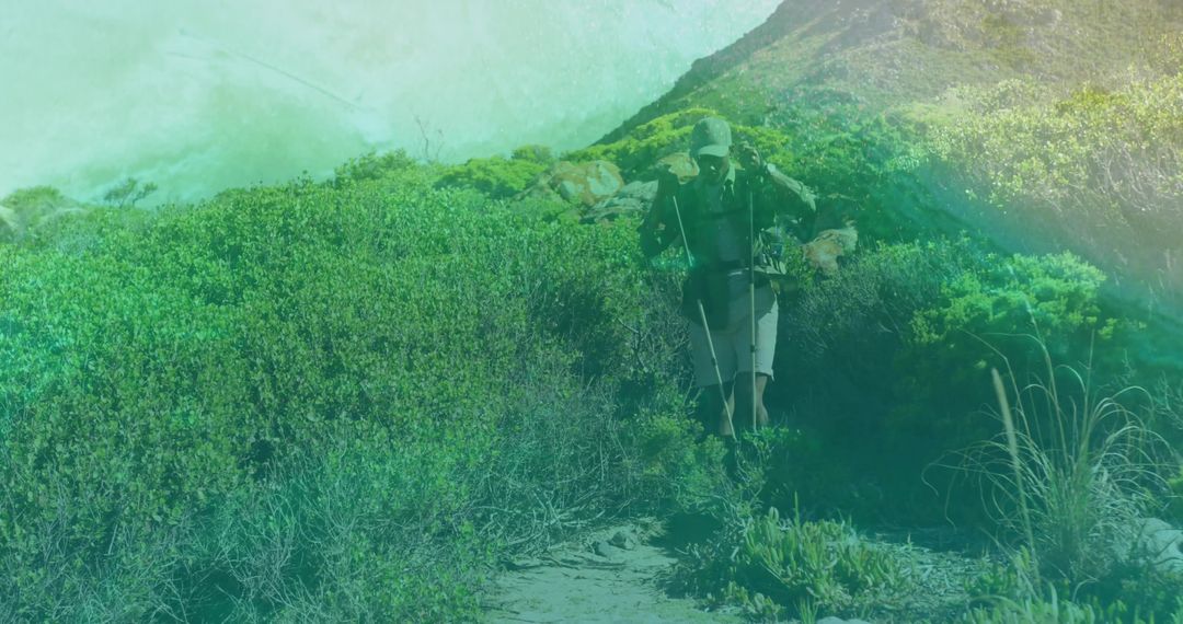 Hiker on Rugged Coastal Trail with Backpack and Trekking Gear