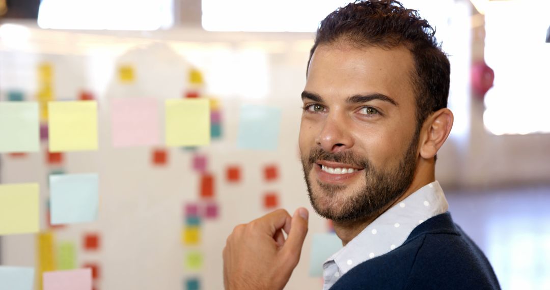 Confident Businessman Smiling at Office Whiteboard with Sticky Notes - Free Images, Stock Photos and Pictures on Pikwizard.com