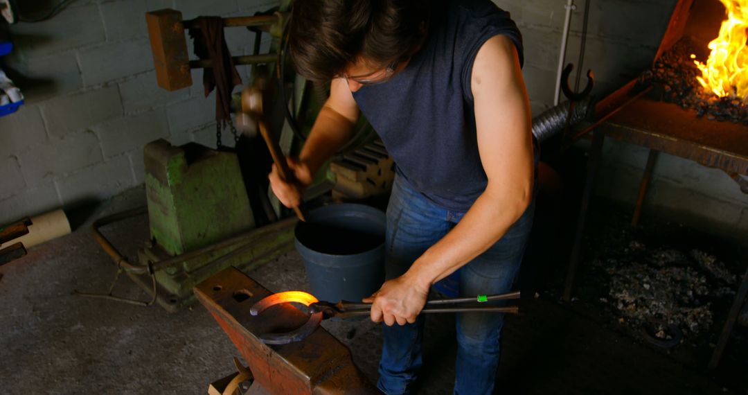 Blacksmith Forging Hot Metal in Traditional Workshop - Free Images, Stock Photos and Pictures on Pikwizard.com