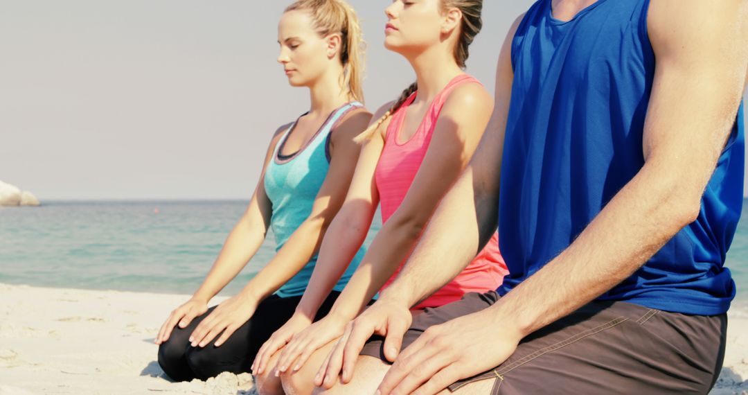 People Meditating on Beach in Relaxing Summer Atmosphere - Free Images, Stock Photos and Pictures on Pikwizard.com