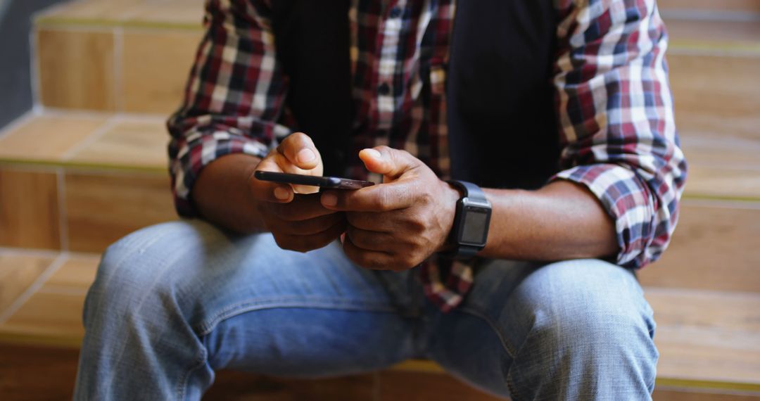 Man Sitting on Stairs Using Smartphone - Free Images, Stock Photos and Pictures on Pikwizard.com