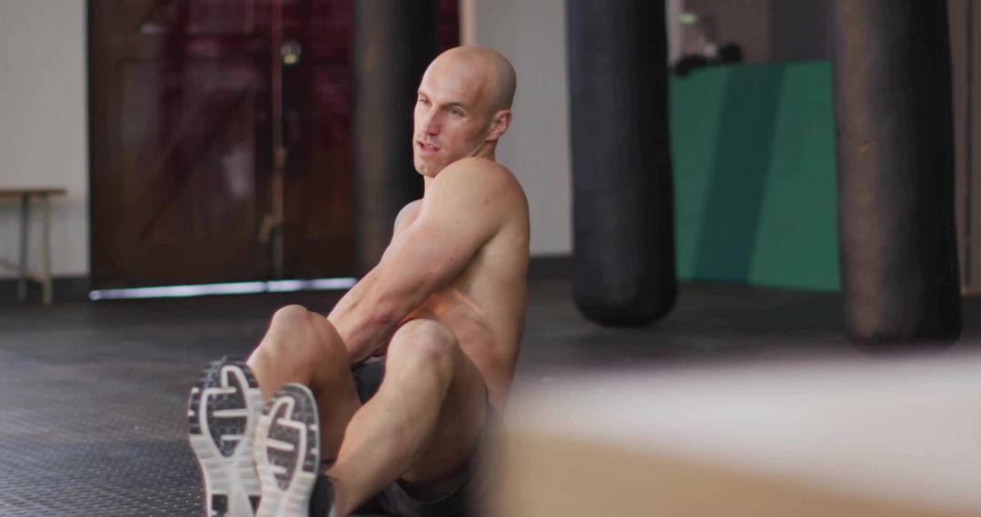 Athlete Strengthens Core with Intense Abdominal Exercise