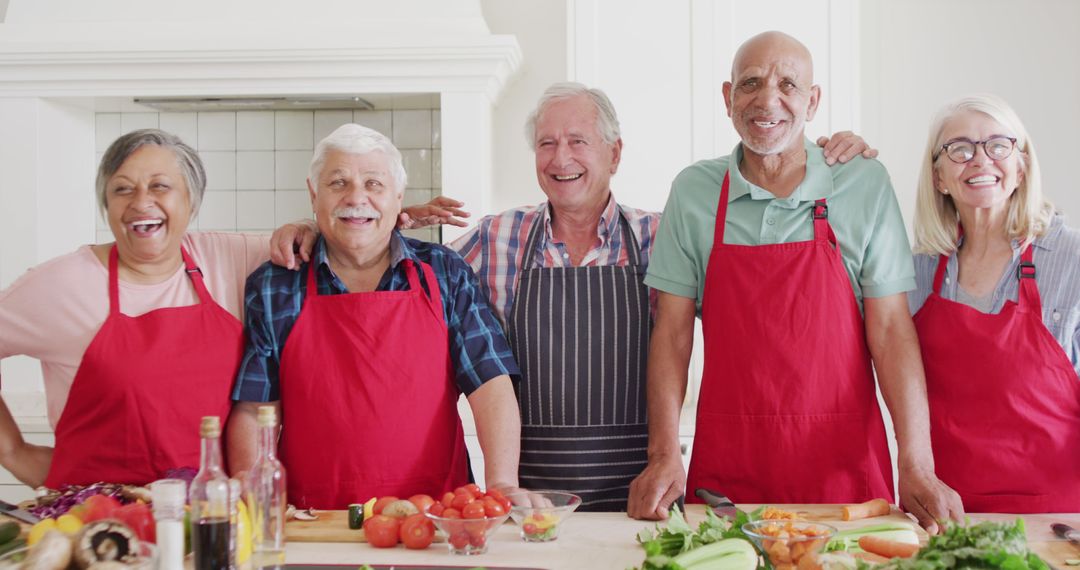 Group of Elderly Friends Cooking Together in Kitchen - Free Images, Stock Photos and Pictures on Pikwizard.com