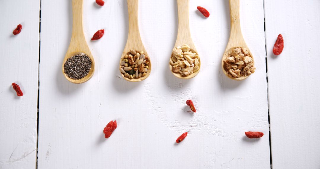 Assortment of Superfoods in Wooden Spoons on White Background - Free Images, Stock Photos and Pictures on Pikwizard.com