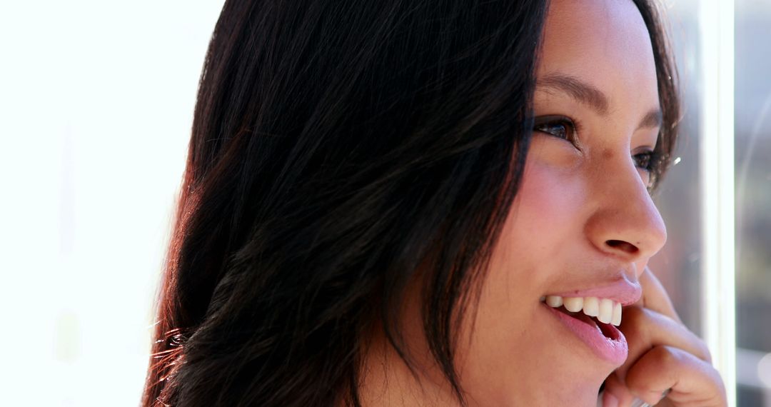 Confident Businesswoman Smiling on Phone Call at Office Desk