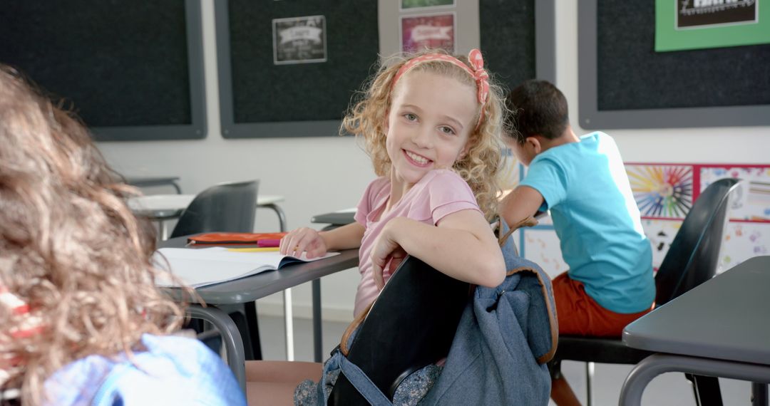 Cheerful Blonde Girl Smiling in Classroom Environment