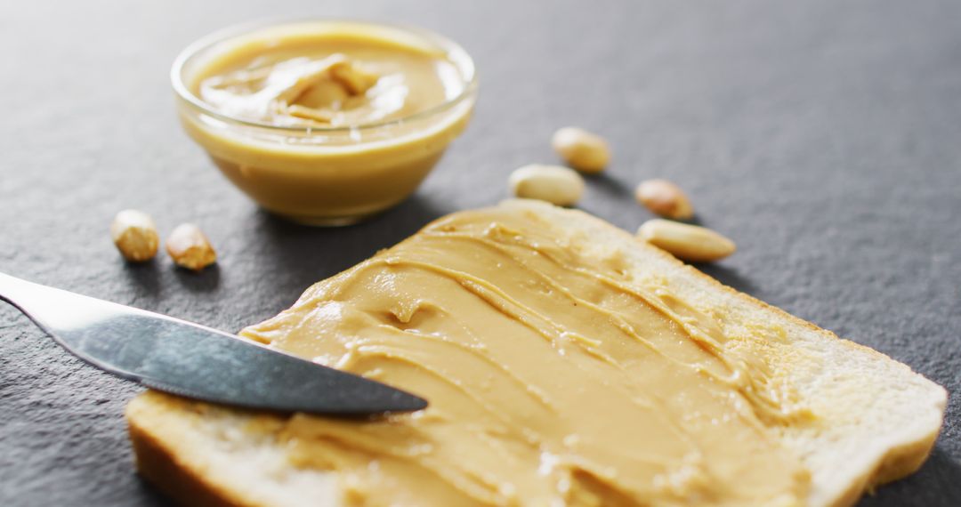 Delicious Toast with Creamy Peanut Butter on Plate