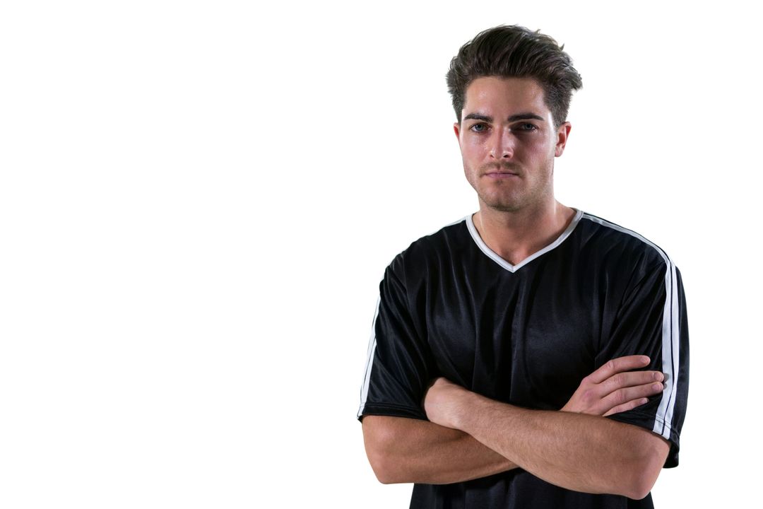Portrait of football player standing with arms crossed - Free Images, Stock Photos and Pictures on Pikwizard.com