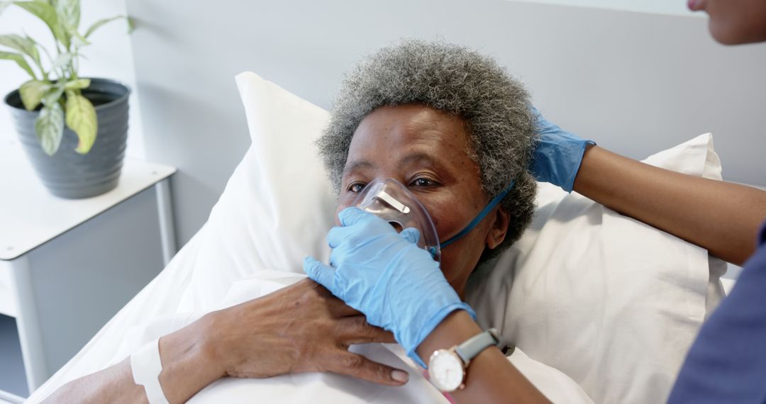 Healthcare Professional Assisting Elderly Patient with Oxygen Mask - Free Images, Stock Photos and Pictures on Pikwizard.com