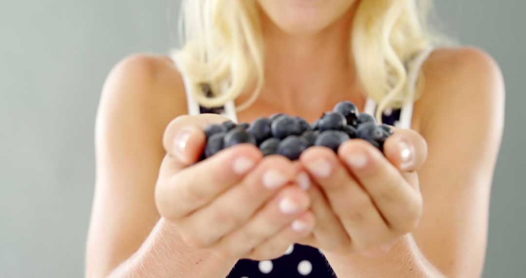 Woman Holding Blueberries with Both Hands - Free Images, Stock Photos and Pictures on Pikwizard.com