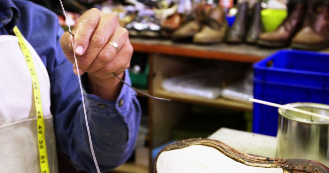 Craftsman Stitching Leather Boot by Hand in Workshop - Free Images, Stock Photos and Pictures on Pikwizard.com