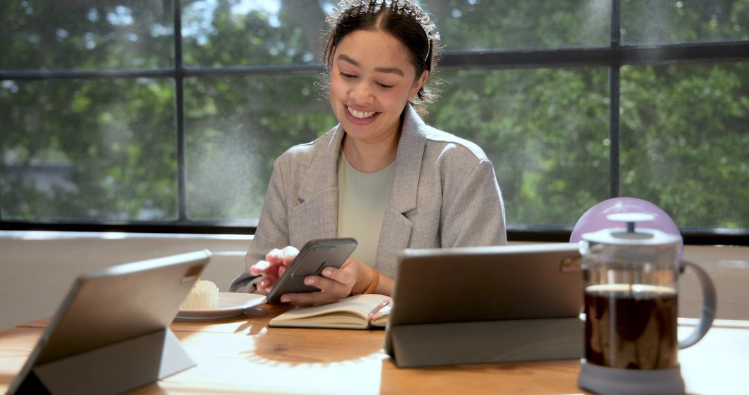 Smiling Businesswoman Working with Technology in Modern Office