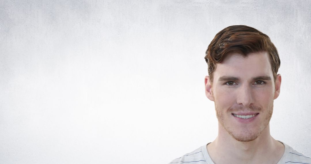 Caucasian Man Smiling Against Textured Grey Background
