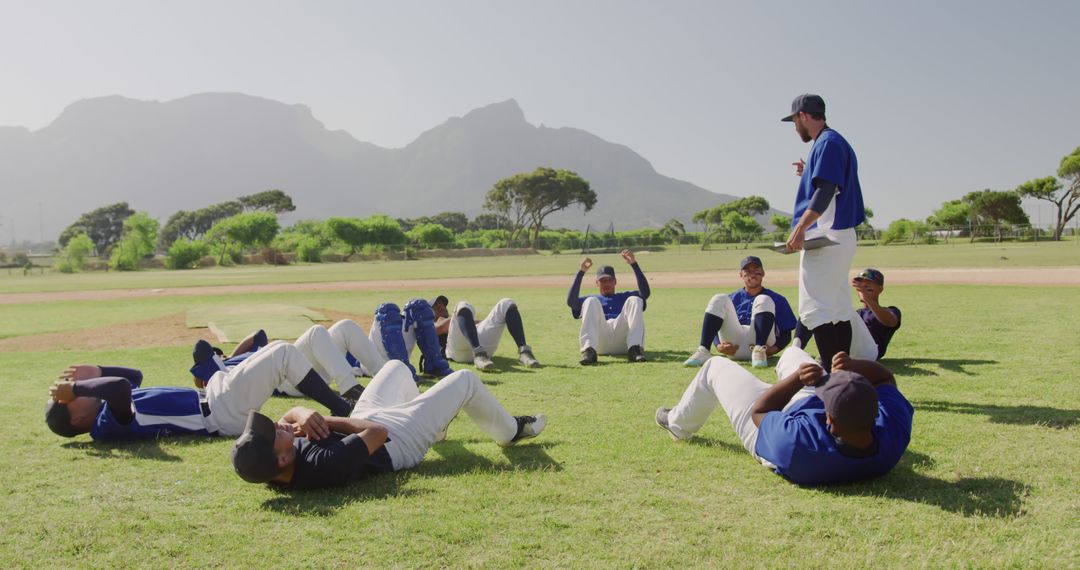 Coach Leading Warm-up Exercises for Baseball Team Outdoors - Free Images, Stock Photos and Pictures on Pikwizard.com