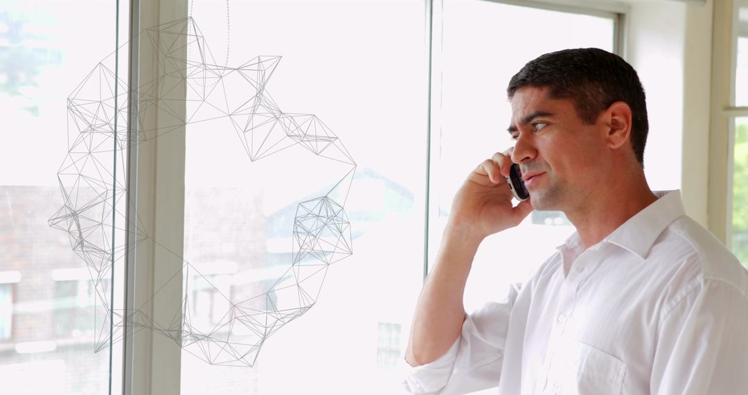 Professional Businessman Communicating on Smartphone in Modern Office