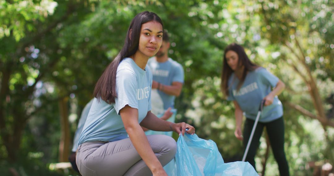 Eco Volunteers Collecting Litter in Forest Environment