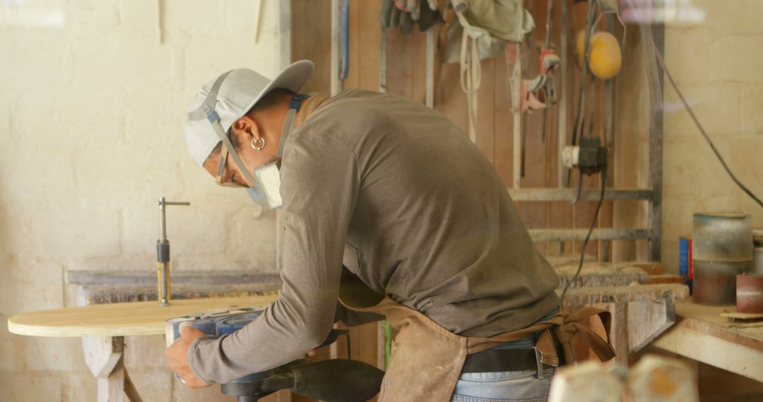 Carpenter Working on Wooden Surfboard in Workshop - Free Images, Stock Photos and Pictures on Pikwizard.com