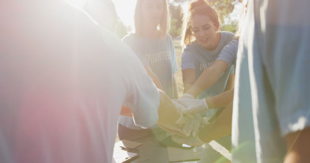 Volunteers Joining Hands for Environmental Conservation - Free Images, Stock Photos and Pictures on Pikwizard.com