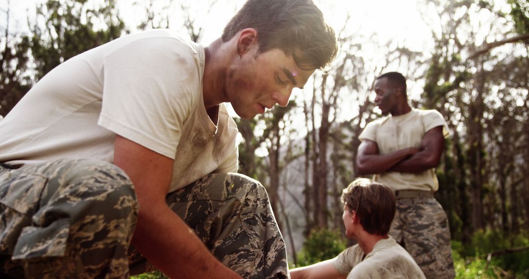 Military Cadets Engage in Team-Building Exercise in Forest