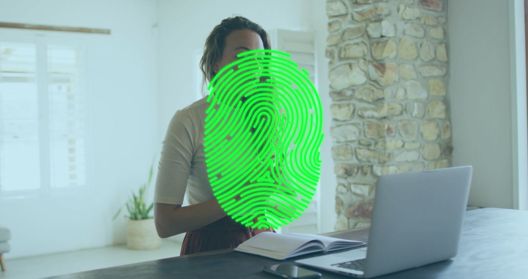 Biometric Fingerprint Scanner with Woman Working Remotely at Home