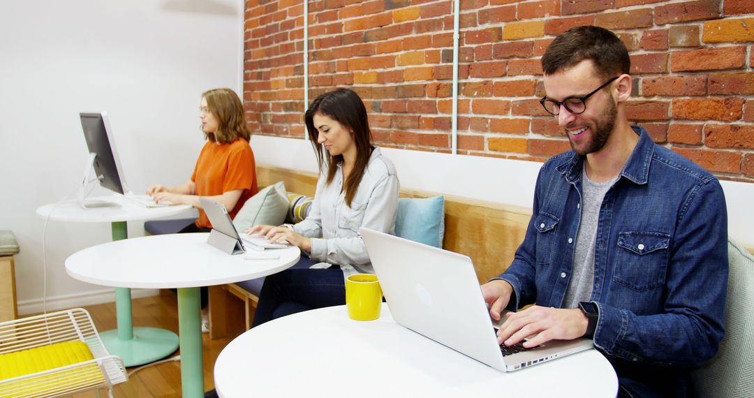 Team Collaborating in Stylish Office with Exposed Brick Walls