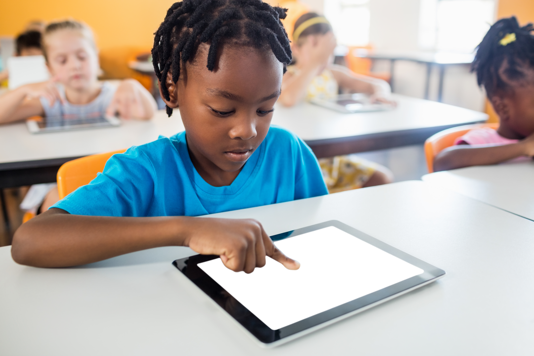 Young Student Engaging with Tablet in Classroom Aligned, Transparent Background - Download Free Stock Images Pikwizard.com