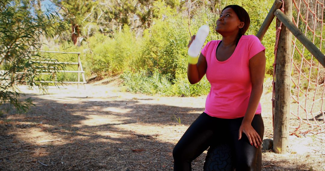 Woman Taking a Hydration Break During Outdoor Workout - Free Images, Stock Photos and Pictures on Pikwizard.com