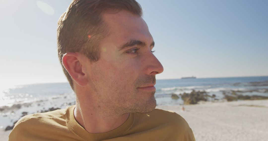 Close-Up of Man Relaxing at the Beach on a Sunny Day - Free Images, Stock Photos and Pictures on Pikwizard.com